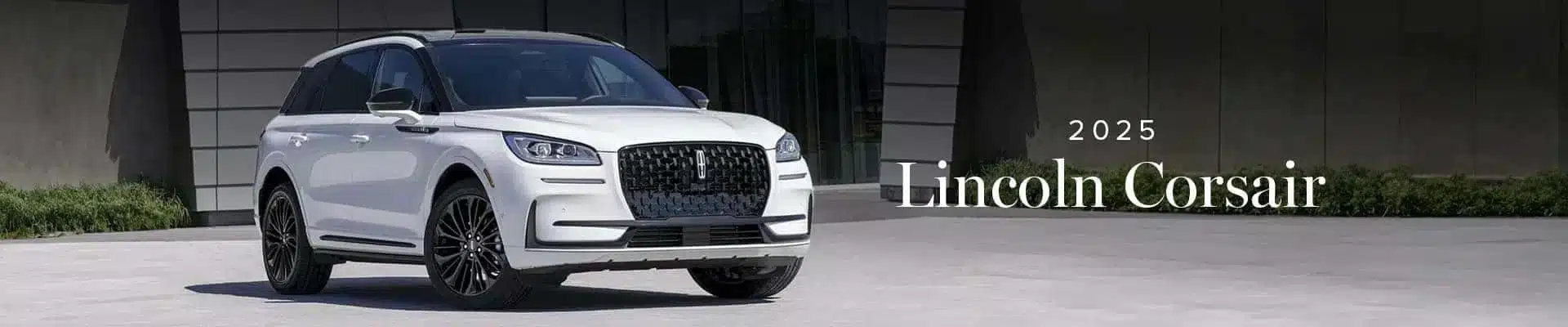 2025 Lincoln Corsair SUV in white, parked in front of a modern building.